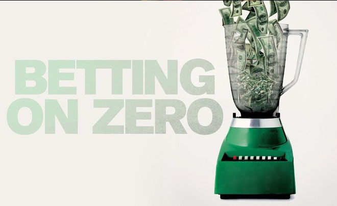Máy xay sinh tố chứa đầy tiền đô la, bên cạnh là dòng chữ "Betting on Zero".