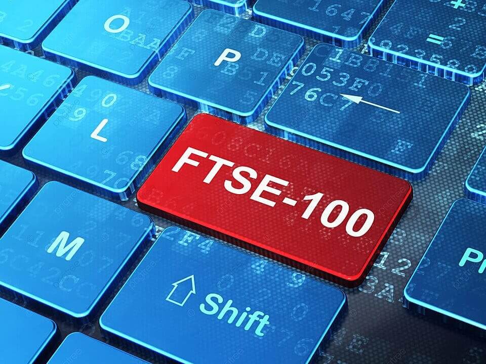 Bàn phím máy tính với phím màu đỏ ghi "FTSE-100" nổi bật giữa các phím màu xanh.
