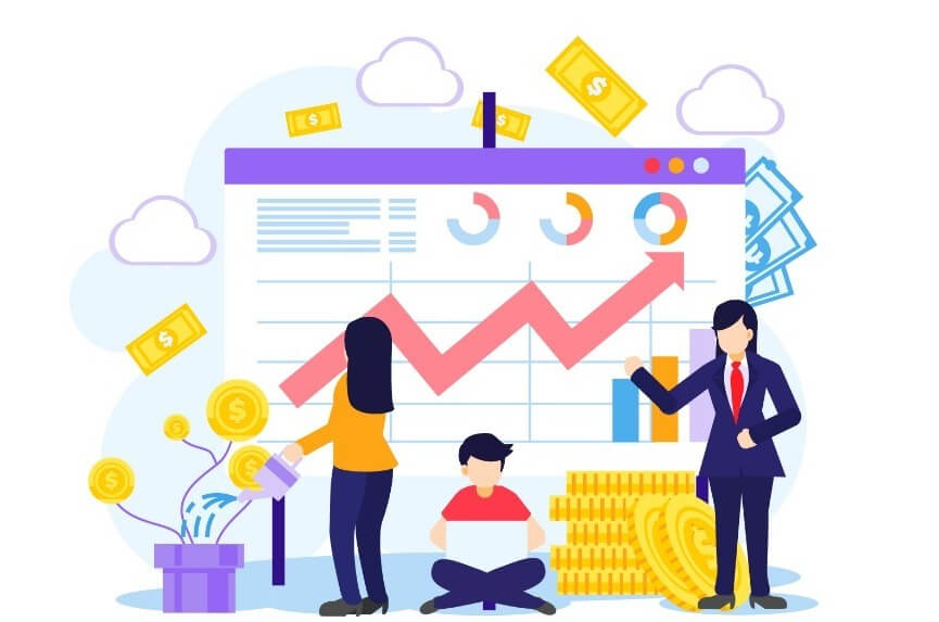 Ba người đang làm việc trước biểu đồ tài chính với xu hướng tăng, xung quanh có tiền xu và tiền giấy.