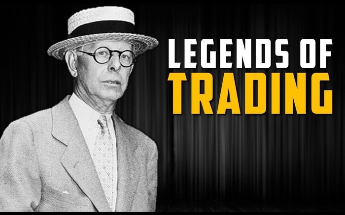 Hình ảnh người đàn ông đội mũ và mặc vest, bên cạnh là dòng chữ "Legends of Trading".