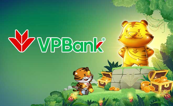 Hình minh họa hai con hổ hoạt hình, một lớn một nhỏ, đứng cạnh đống vàng, nền xanh, logo VPBank phía trên.